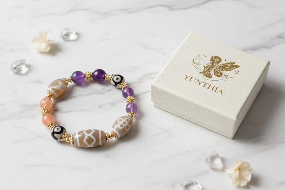 Mixed-Gem Tibetan Dzi Talisman Bracelet with Amethyst Citrine and Sunstone beside authentic YUNTHIA jewelry box for wealth and spiritual protection