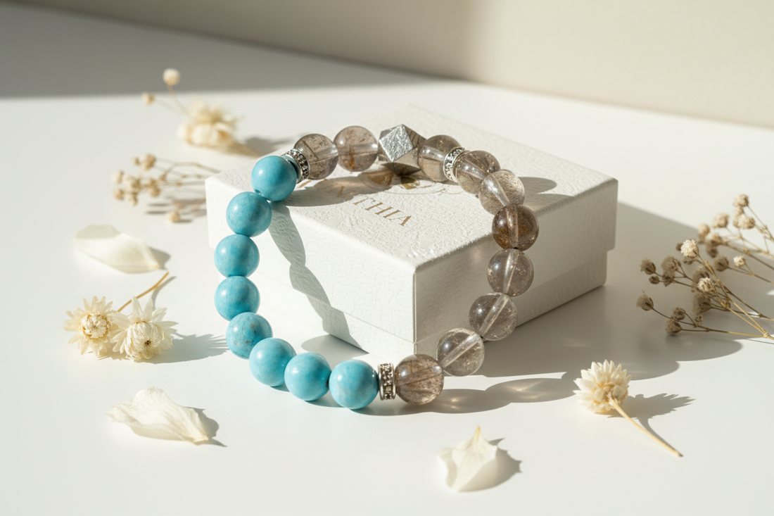 Natural Super Seven crystal talisman bracelet beside authentic YUNTHIA jewelry box for spiritual empowerment